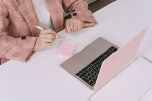 A person reviewing notes at a desk