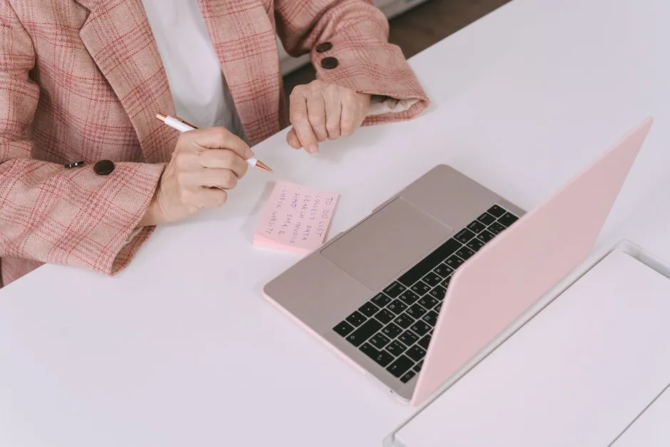 A person reviewing notes at a desk