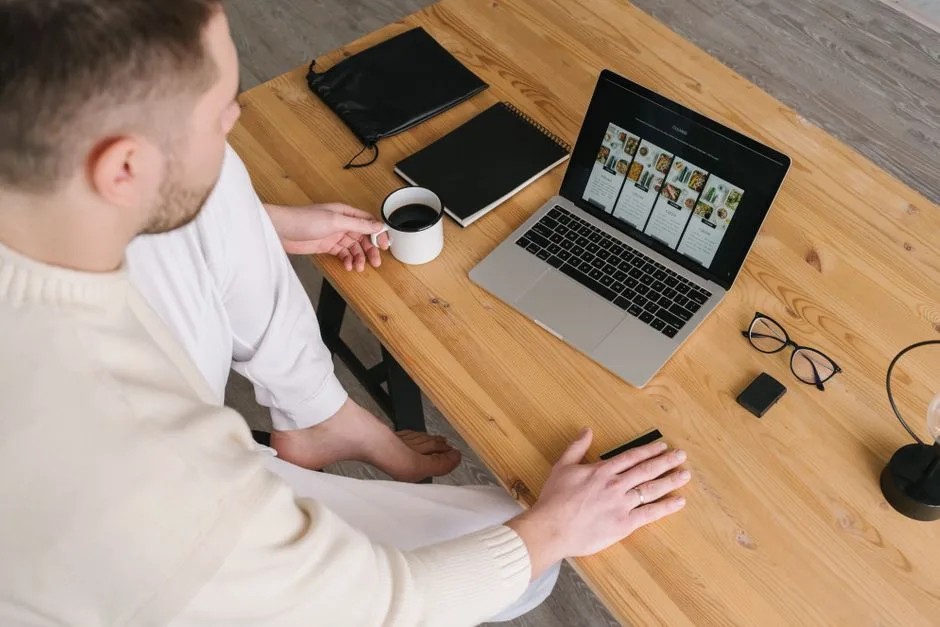 Person reviewing information on a laptop at a desk