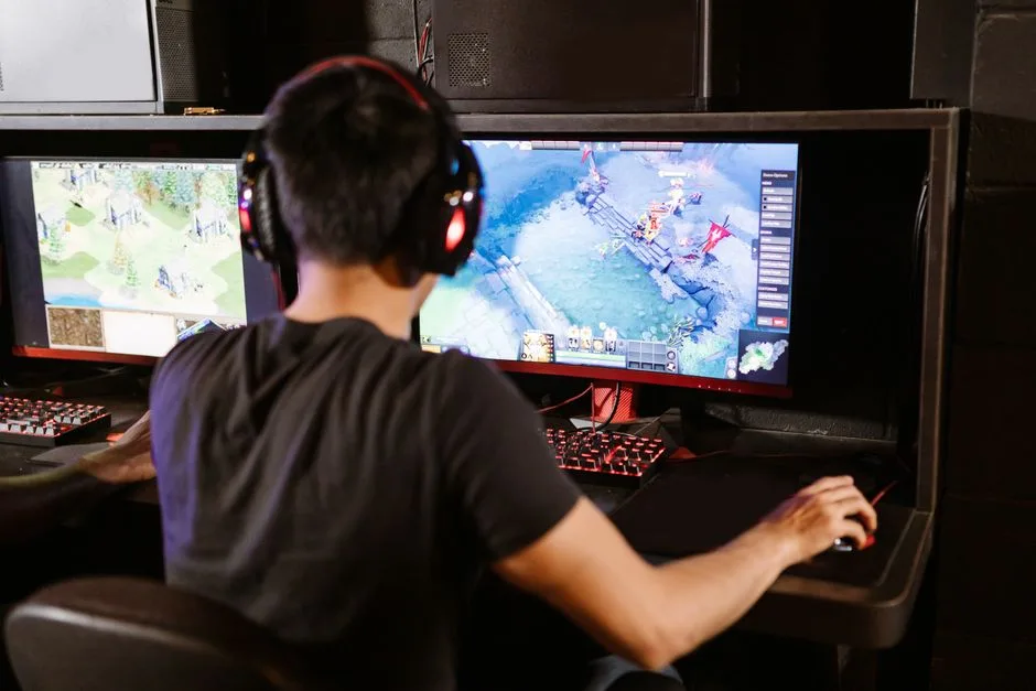 Person comparing options at a desk with a computer and notebook