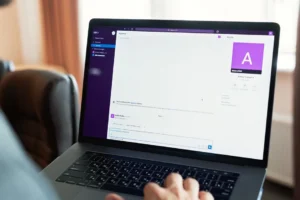 Person comparing chat, visual creation, video, and coding work on a laptop