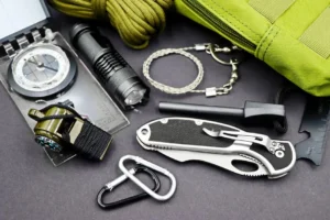 Backpack and field equipment arranged on a table