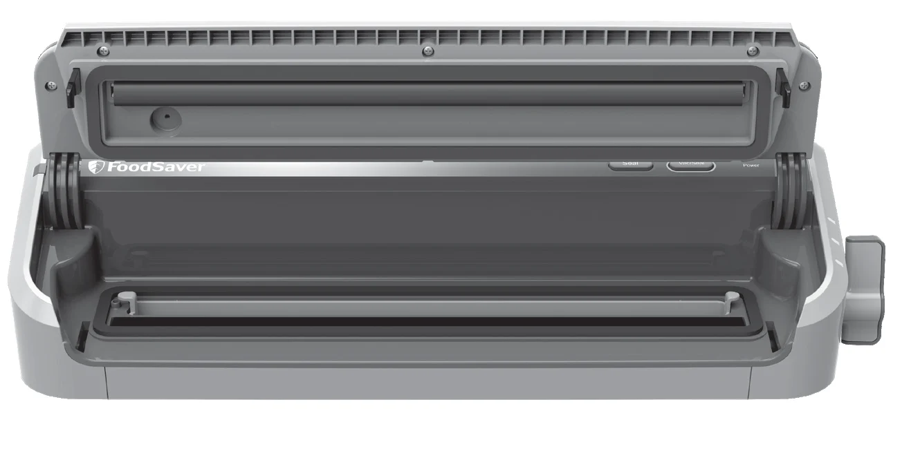 FoodSaver FM2000의 열린 뚜껑과 위아래 패킹, 진공채널 위치